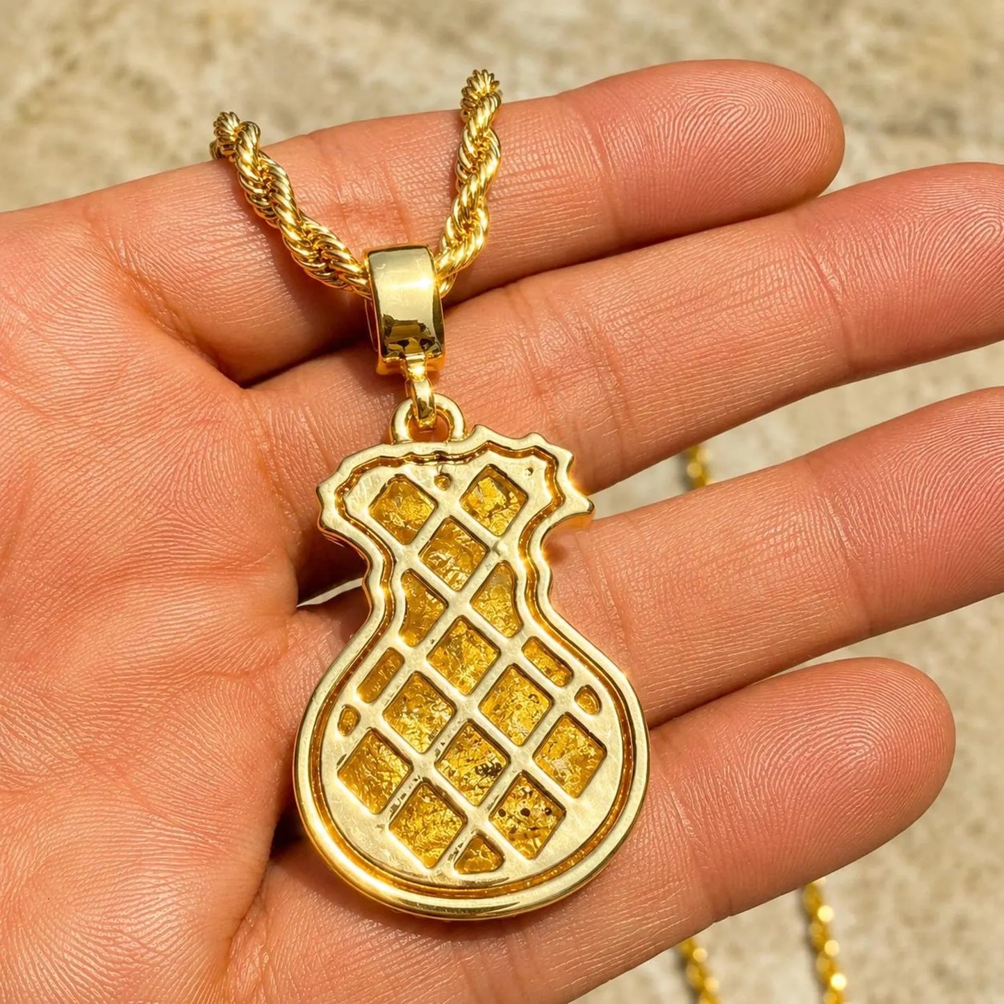Arvani 14K gold plated dollar sign CZ pendant, iced-out money symbol angled view