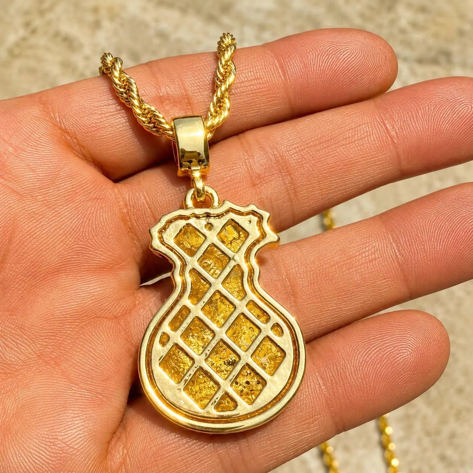 Arvani 14K gold plated dollar sign CZ pendant, iced-out money symbol angled view